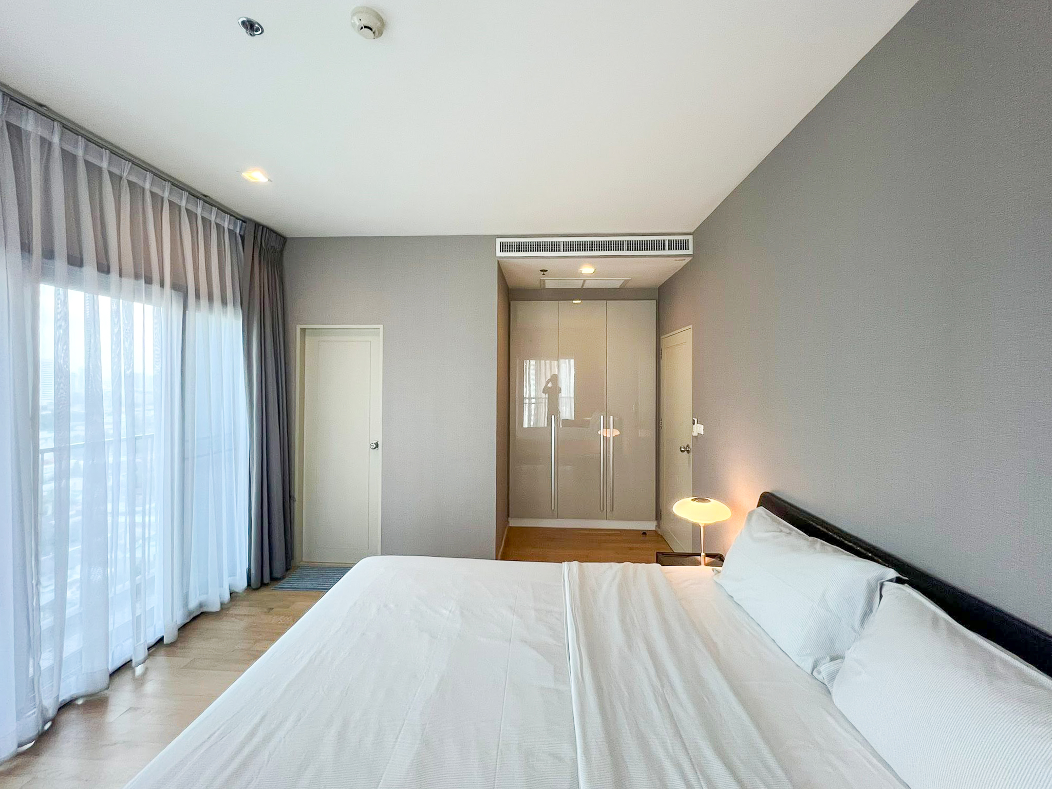 Spacious 2-bedroom, 2-bathroom condo for rent at Noble Reveal Ekkamai. Only 300m from BTS, fully furnished, 75 sqm, with indoor pool and gym. Rent: 60,000 THB/month.
