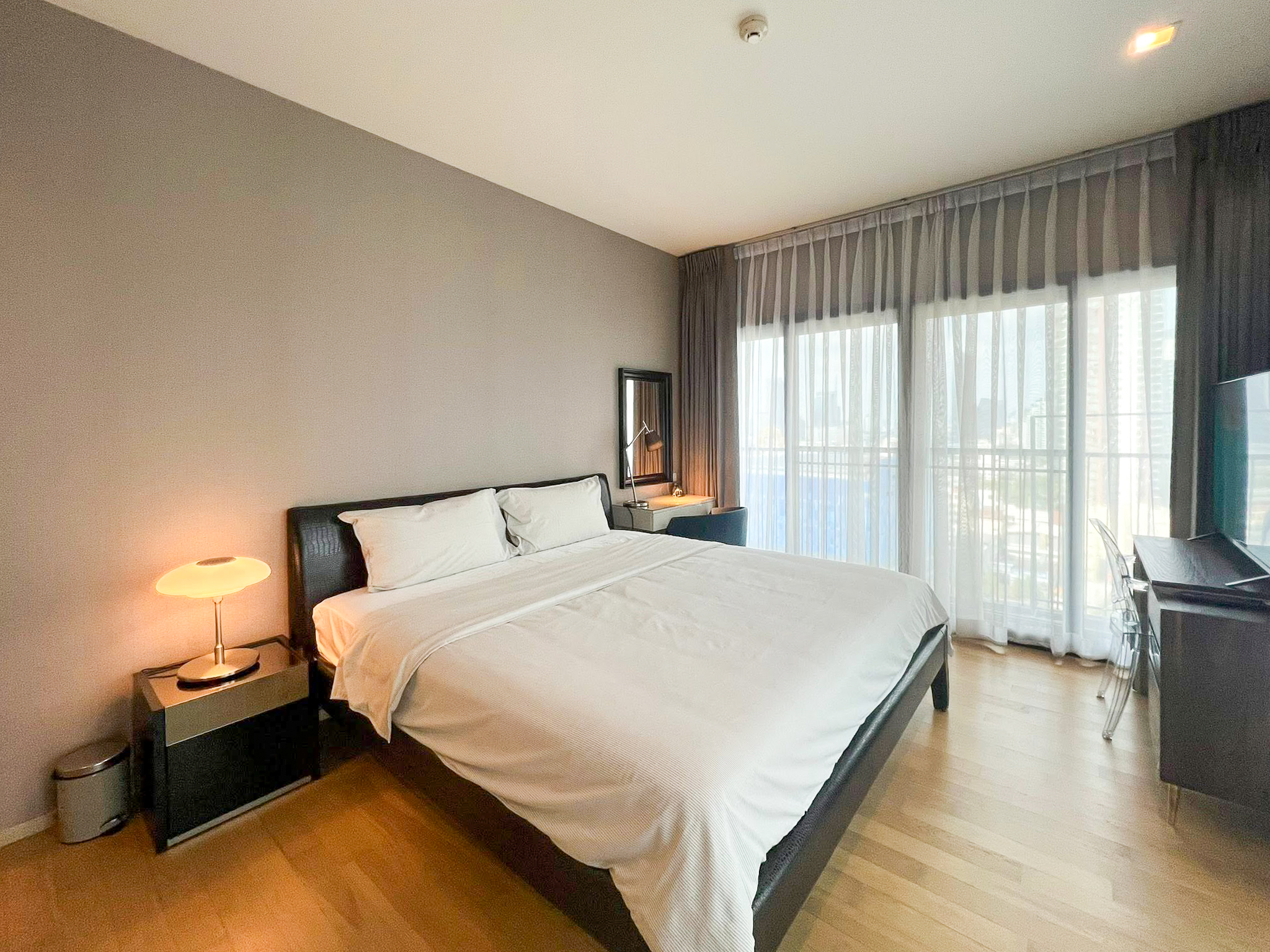 Spacious 2-bedroom, 2-bathroom condo for rent at Noble Reveal Ekkamai. Only 300m from BTS, fully furnished, 75 sqm, with indoor pool and gym. Rent: 60,000 THB/month.