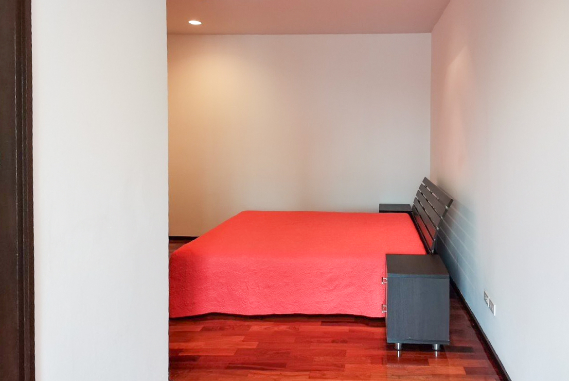 108 sqm 2-bedroom condo for rent on Sukhumvit 55. Fully furnished, high floor, modern kitchen, city view, 50,000 THB/month with full facilities.