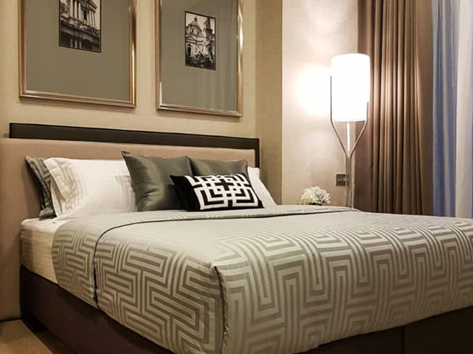 Luxury high-floor 2-bedroom condo for rent at The ESSE Asoke. Fully furnished with skyline views, top facilities, and prime Asoke location. Rent 70,000 THB/month.