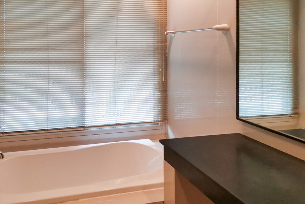 108 sqm 2-bedroom condo for rent on Sukhumvit 55. Fully furnished, high floor, modern kitchen, city view, 50,000 THB/month with full facilities.