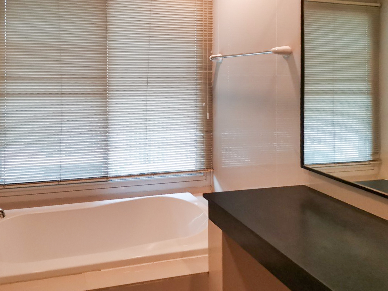 108 sqm 2-bedroom condo for rent on Sukhumvit 55. Fully furnished, high floor, modern kitchen, city view, 50,000 THB/month with full facilities.