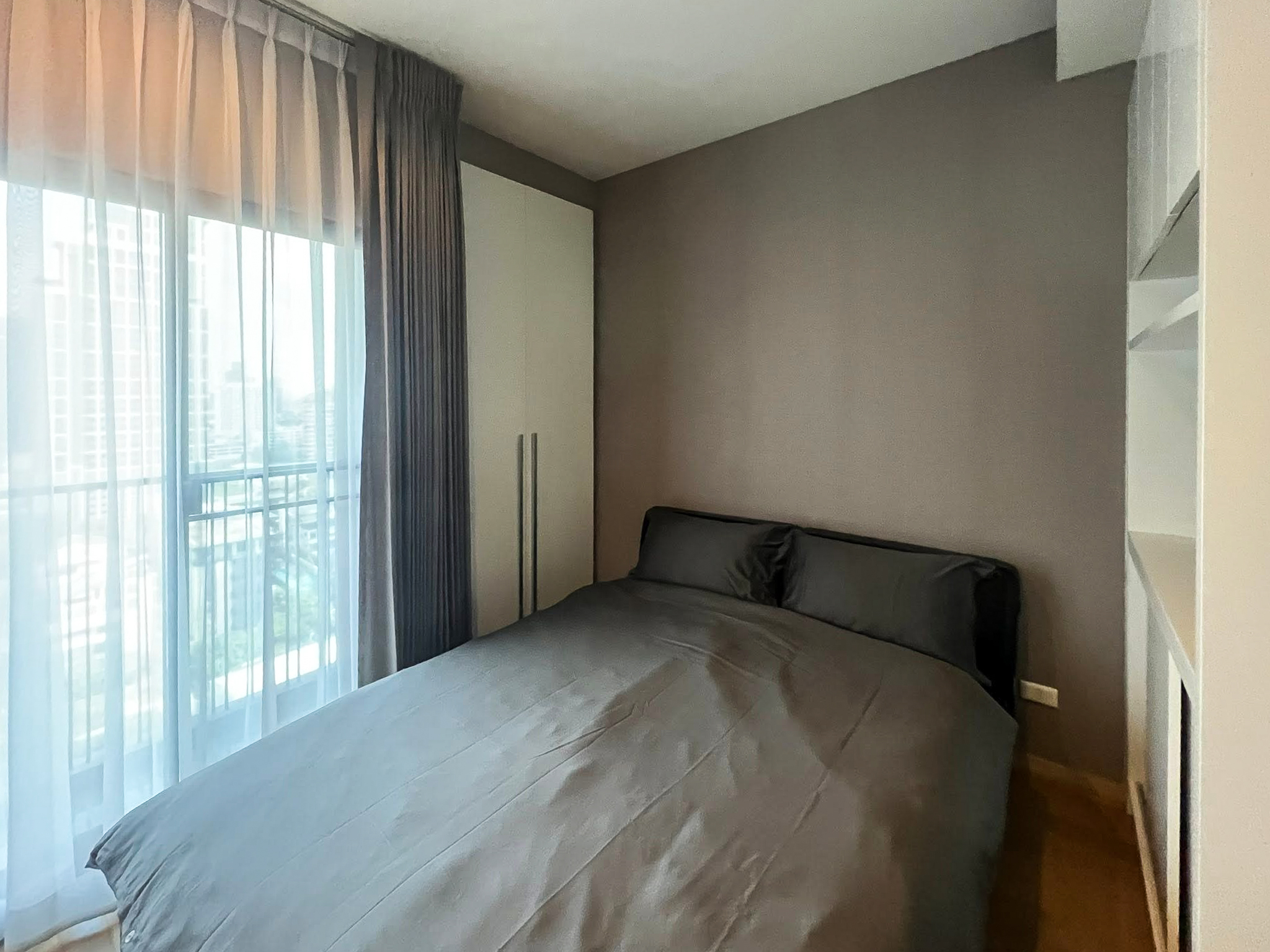 Spacious 2-bedroom, 2-bathroom condo for rent at Noble Reveal Ekkamai. Only 300m from BTS, fully furnished, 75 sqm, with indoor pool and gym. Rent: 60,000 THB/month.