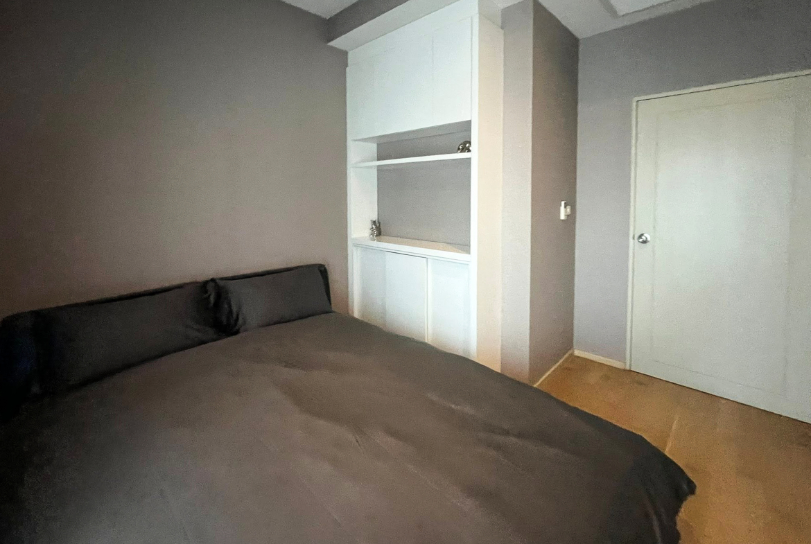Spacious 2-bedroom, 2-bathroom condo for rent at Noble Reveal Ekkamai. Only 300m from BTS, fully furnished, 75 sqm, with indoor pool and gym. Rent: 60,000 THB/month.