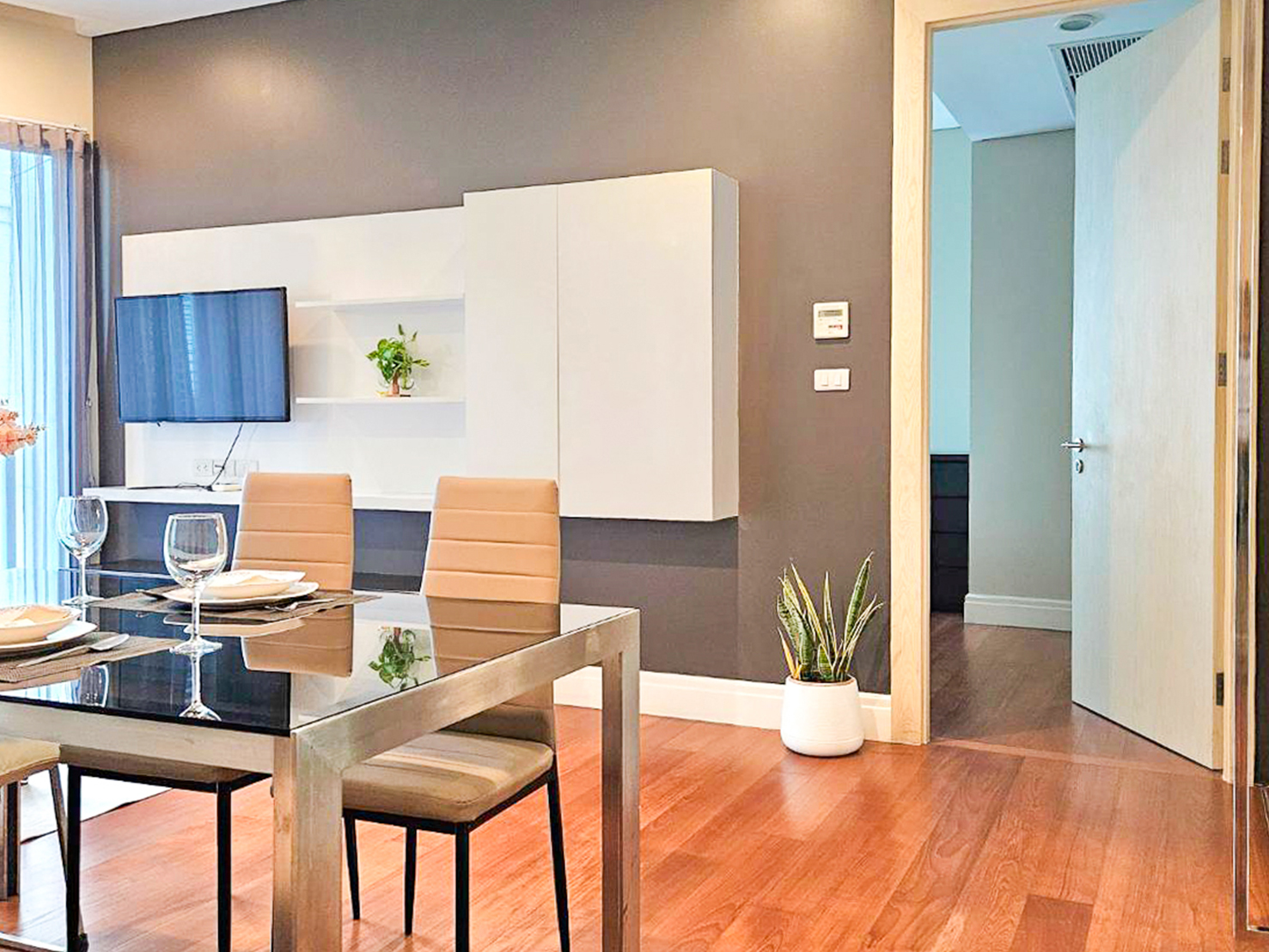 Spacious and newly renovated 1-bedroom corner condo for rent at Bright Sukhumvit 24, 70 sqm, fully furnished, with EV charger and luxury facilities.