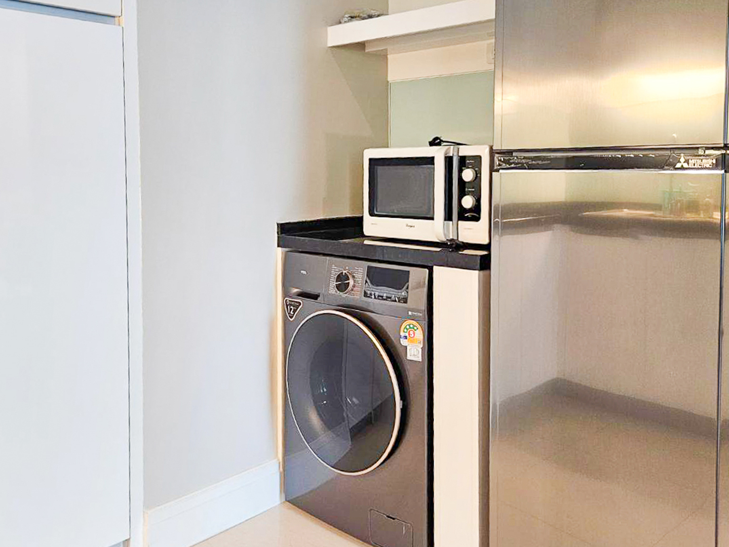 Spacious and newly renovated 1-bedroom corner condo for rent at Bright Sukhumvit 24, 70 sqm, fully furnished, with EV charger and luxury facilities.