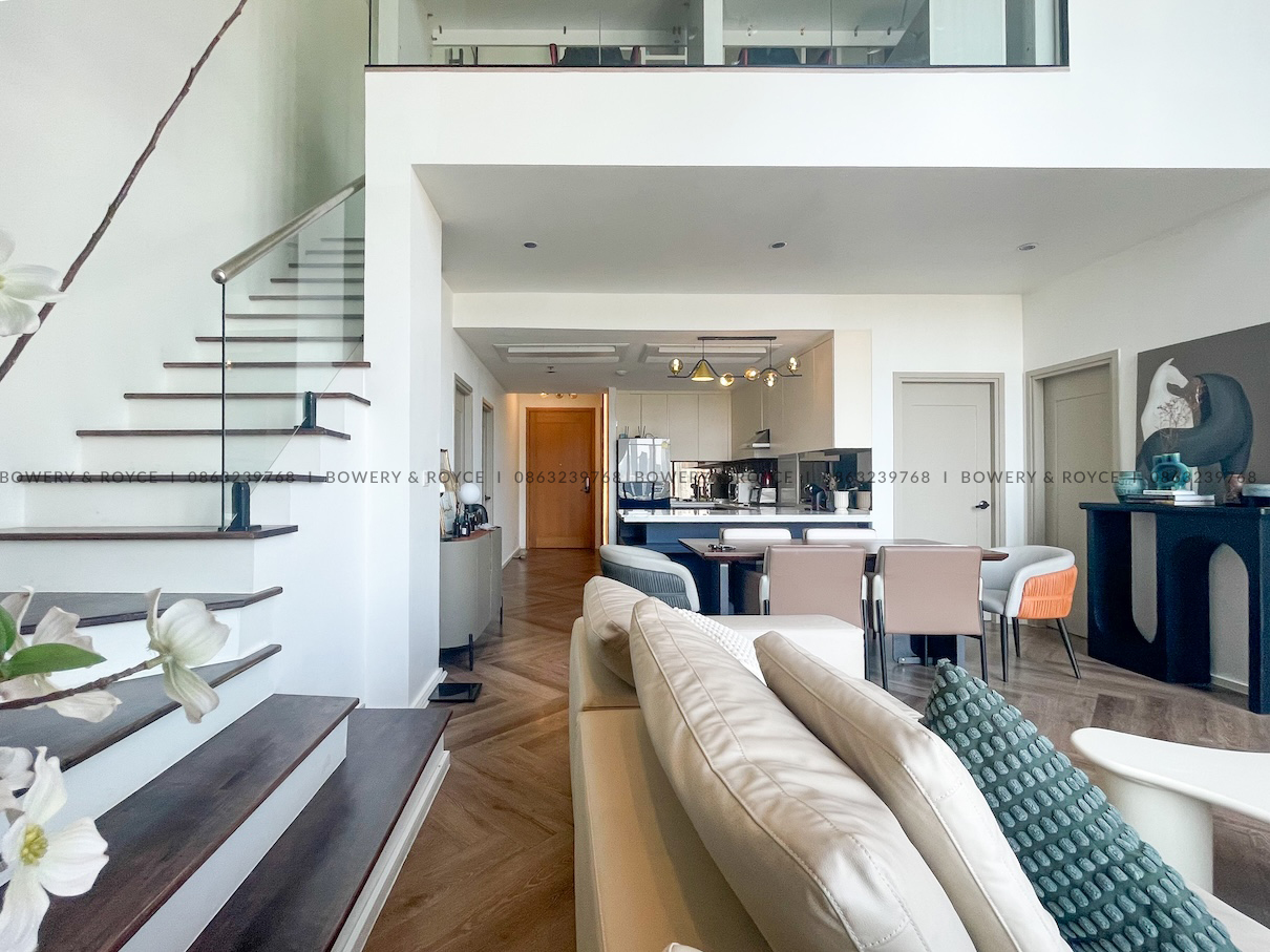 Stunning 122 sqm duplex at The Emporio Place Sukhumvit 24 with double-height ceiling and floor-to-ceiling windows.